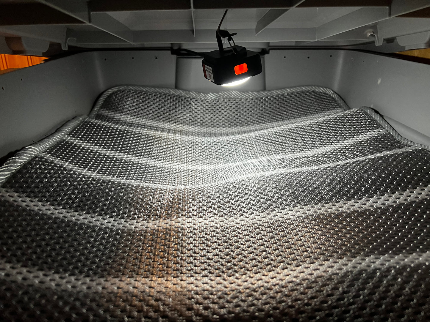 Bloom & Garden worm bedding with LED light showing textured surface under bright illumination